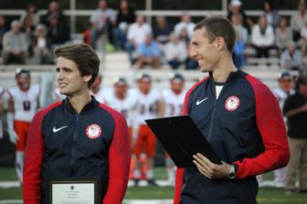 Hometown Olympians Andrew Campbell (l) and Charlie Cole (r) are honored before the game. Credit: Terry Dinan
