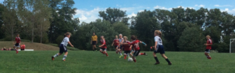 Paige Place drives the play forward for the New Canaan Girl’s U10 Red Team which defeated Westport Whites 1-0. Contributed