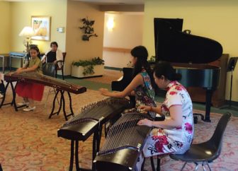 Angelina Hubertus, left, played a concert at the New Canaan Inn on Sept. 4. She played both piano and the Chinese Zither, a 3,000-year-old instrument. Contributed