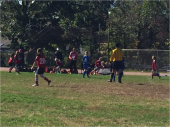 New Canaan’s U10 Mighty Reds showcase teamwork, skill and precision during their victory over Old Greenwich Blue, 4-0. Contributed